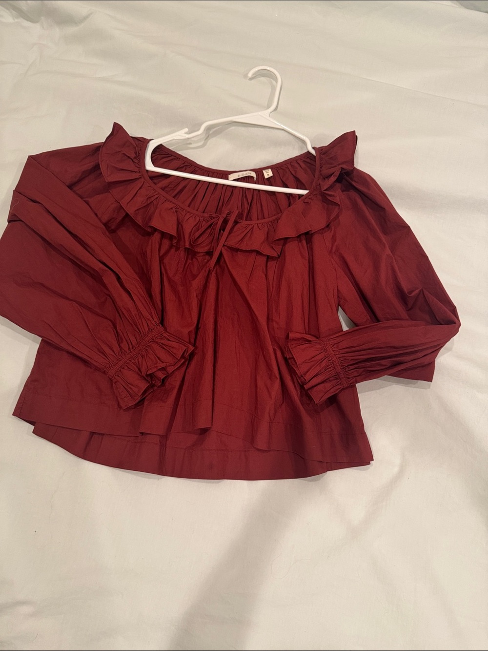 Doen deep rust ruffle neck blouse